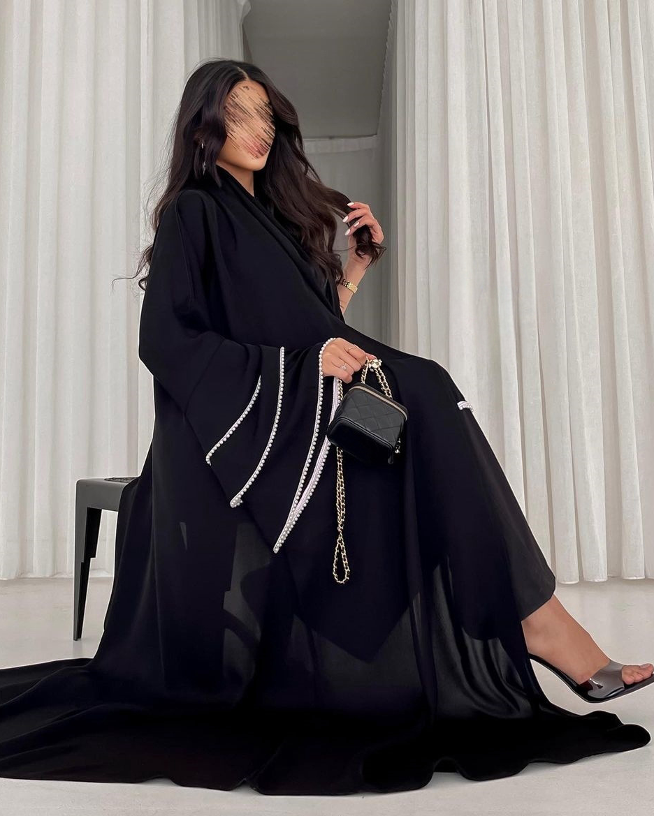 Nadine Al Raqi - Abaya