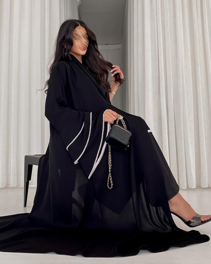 Nadine Al Raqi - Abaya